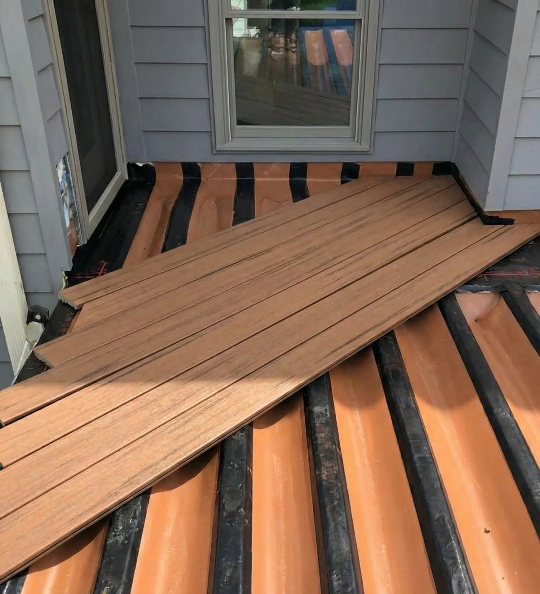 Decks, Porches, and Outdoor Living Under Deck Drainage System Installation