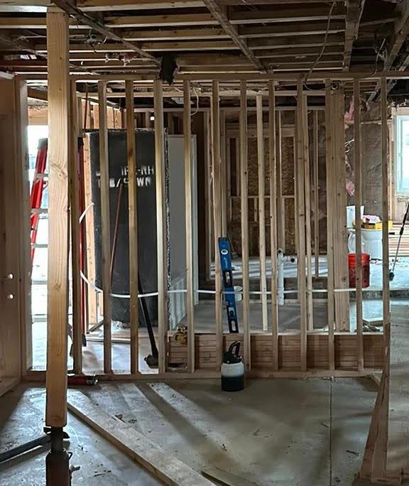 Demolition phase showing exposed framing